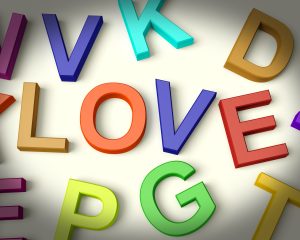 Love Written In Multicolored Plastic Kids Letters
